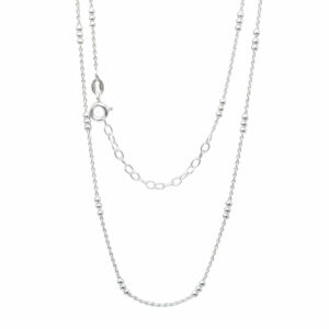 sterling silver triple ball necklace hanging on white background