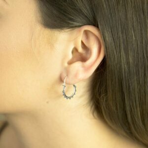 Sterling Silver Persian Waves Hoops on Model with Brown Hair