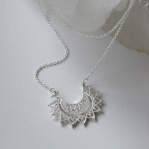 Sterling silver marrakech affair necklace on white background with crystal.