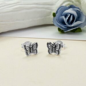 Small Silver Butterfly studs with Blue and white roses in the background