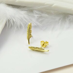 Small Gold feather  with White ceramic feather and white feather as backgound