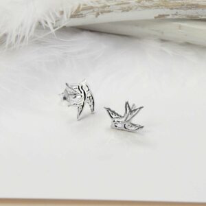 Small Silver Swallow Bird studs with white feather background