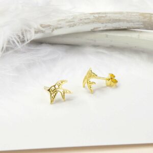 Small Gold Swallow Bird studs with white feather background