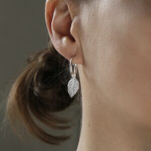 sterling silver leaf hoops studs on model