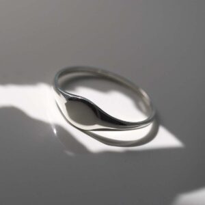 Sterling Silver Oval Pinky Signet Ring in sunlight