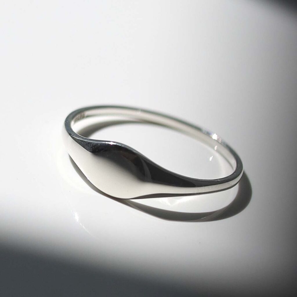 Sterling Silver Oval Pinky Signet Ring in sunlight