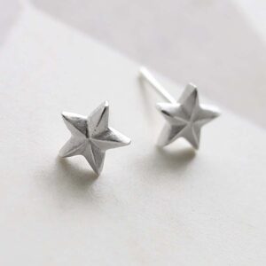Sterling Silver Solid Star Stud Earrings on ceramic background