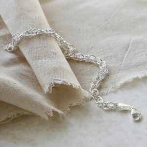 Sterling Silver Twisted Rope Bracelet on a linen material