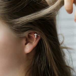 Sterling silver ear cuff round the top of a girls ear