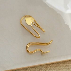 Gold Plated Sterling Silver Heart Ear Cuffs on a white marble tile