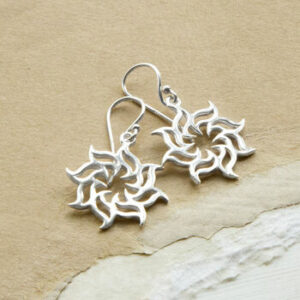 Sterling Silver Fire Star Earrings On Sandy colour background