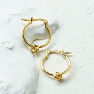 Gold Knot Hoops on white detailed background