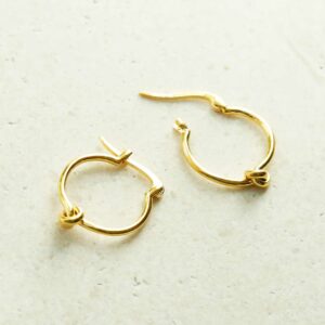 Gold Knot Hoops open and closedon white detailed background