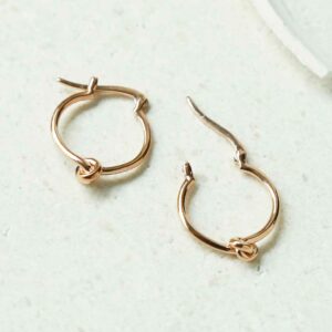 Rose Gold Knot Hoops open and closedon white detailed background