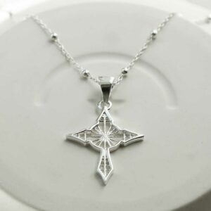 STERLING SILVER STAR CROSS PENDANT NECKLACE ON GREY BACKGROUND