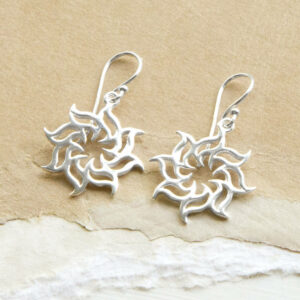 Sterling Silver Fire Star Earrings On Sandy colour background