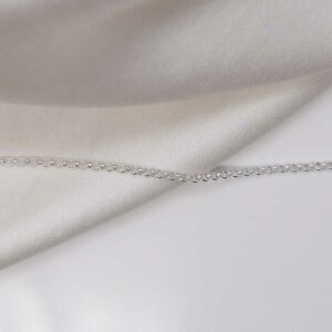 sterling silver belcher chain laid straight on linen