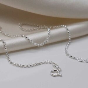 sterling silver belcher chain strewn on linen