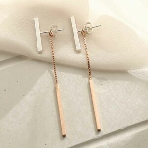 silver and rose gold bars with chain laid straight