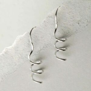 silver bold coil drop earrings hanging