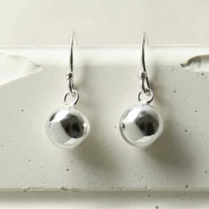 silver single ball dangly earrings hanging