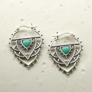 silver exotic hoops with turquoise triangle on tile