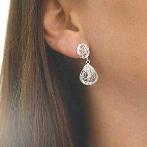 silver teardrop wiry nest earrings on model