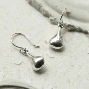 silver tiny pear shaped dangly earrings strewn