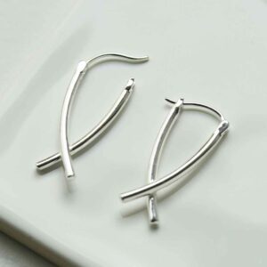 silver crossover bar hoops unlatched on tile