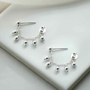 silver lamps on double stud chain on tile