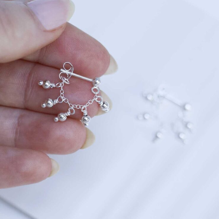 Sterling Silver Hanging Lanterns Chain Studs in models hand