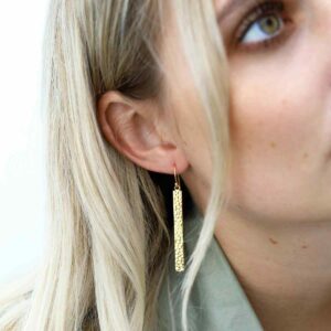 Blonde Model Wearing Gold Hammered Bar Earrings