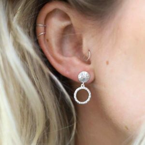 Blonde Model with multiple piercings wearing Silver Door Knocker Earrings