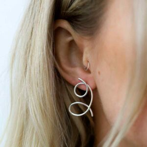 Blonde Model Wearing Sterling Silver Double Loop Studs