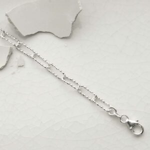 silver hammered paperclip bracelet laid straight