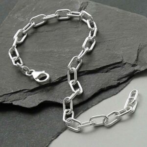 silver chunky paperclip bracelet strewn on slate