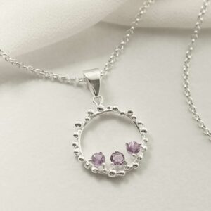 three amethyst gems in water droplets circle pendant on chain