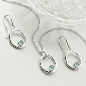 single blue topaz gem in oval dangly earrings and necklace