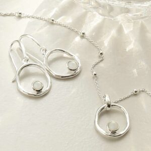 single moonstone gem in oval dangly earrings and necklace