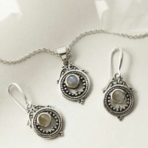 single labradorite gem in decorative earrings and necklace