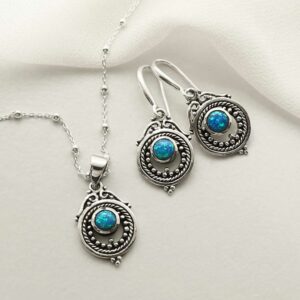 single opalite gem in decorative earrings and necklace