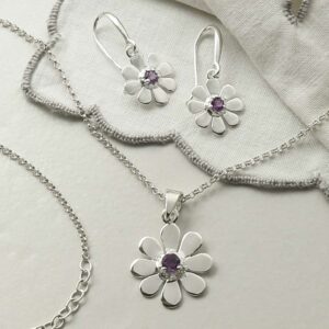 single amethyst gem in centre of daisy earrings and necklace