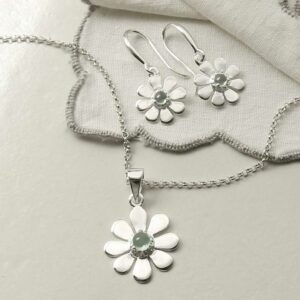 single blue topaz gem in centre of daisy earrings and necklace