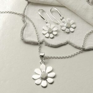 single moonstone gem in centre of daisy earrings and necklace