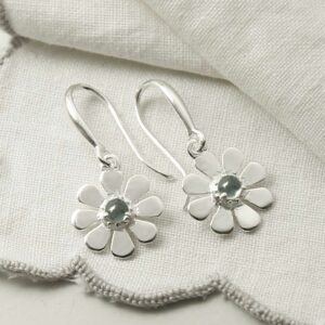 single blue topaz gem in centre of daisy earrings