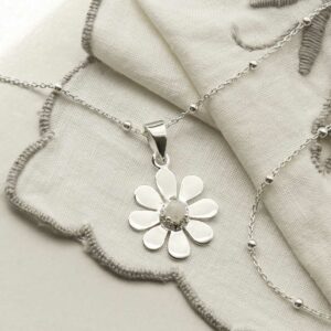 single moonstone gem in centre of daisy pendant