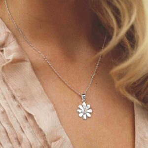 single moonstone gem in centre of daisy pendant on model