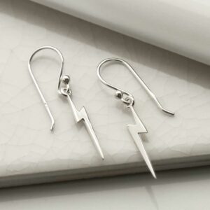 silver lightning dangly earrings laid straight