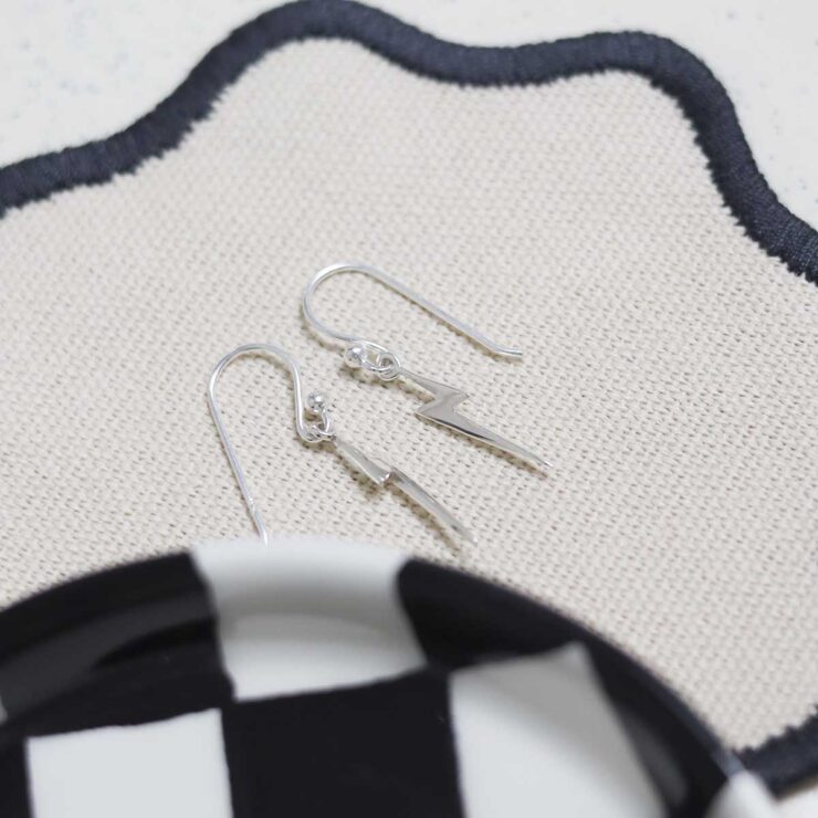 Sterling Silver Lightning Earrings on table