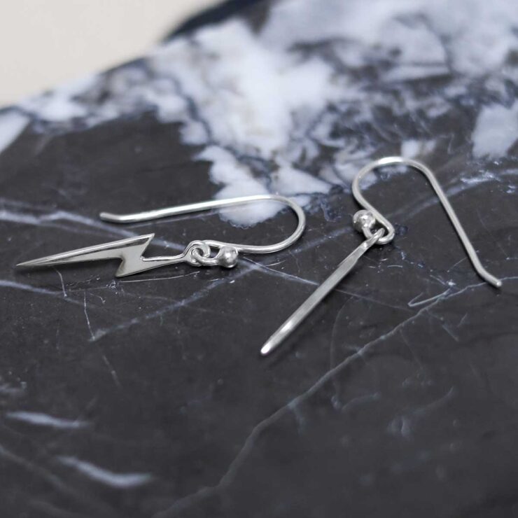 Sterling Silver Lightning Earrings on table
